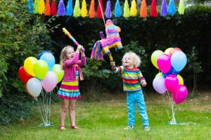Kids,Birthday,Party.,Group,Of,Children,Hitting,Pinata,And,Playing